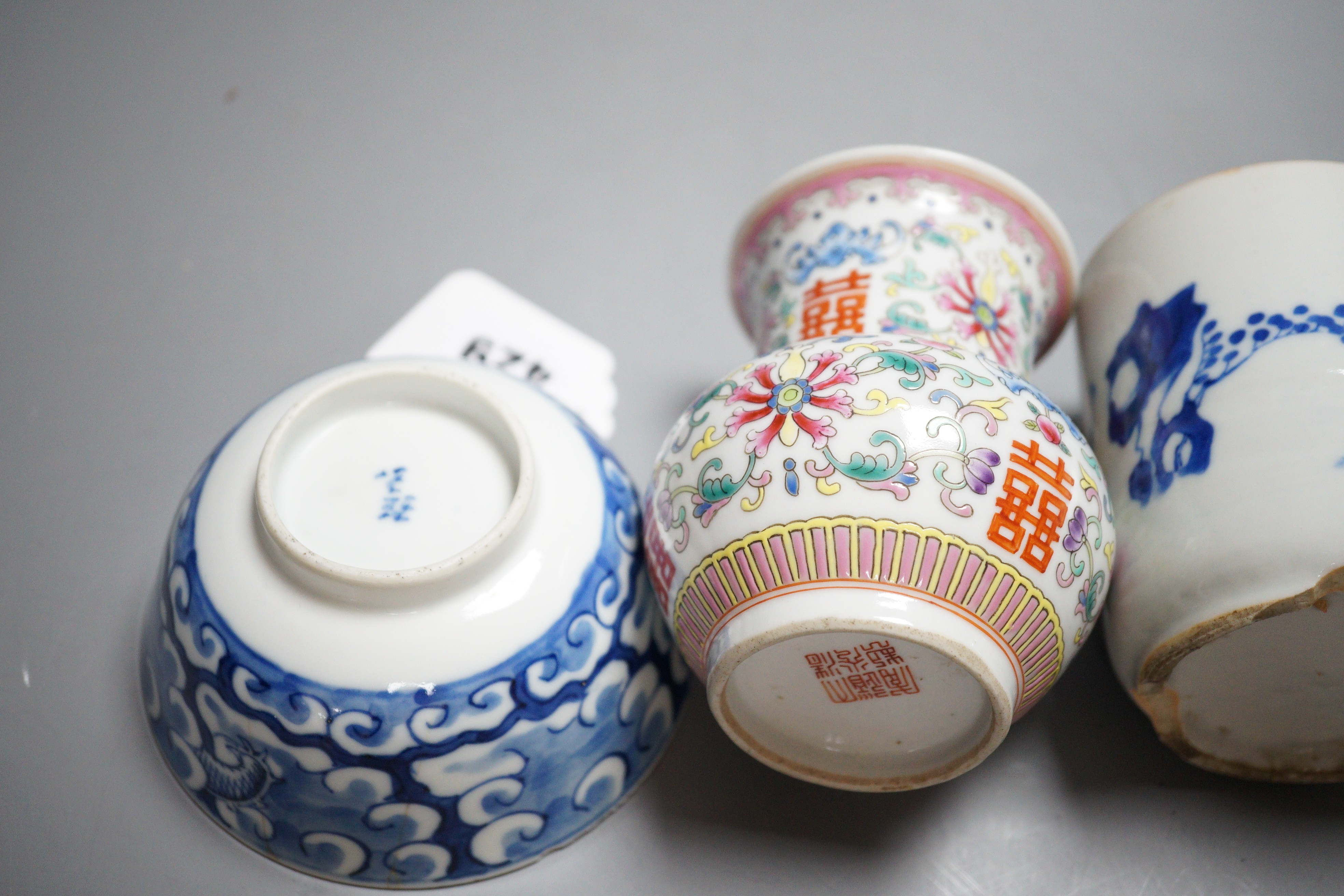 An early 20th century Chinese famille rose vase, a Chinese blue and white jar, lacking cover and a blue and white bowl
